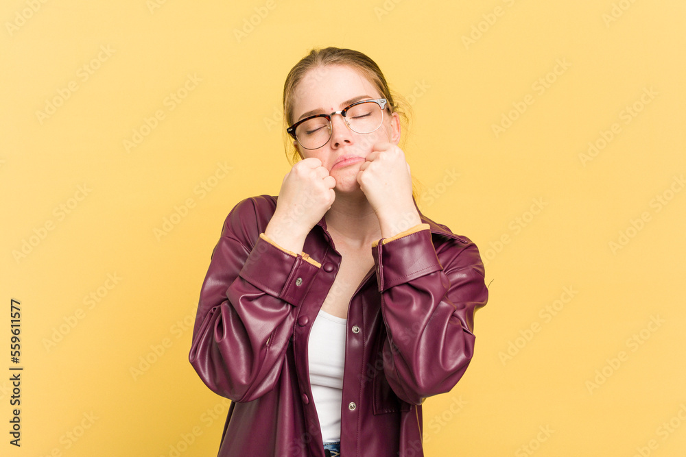 Young caucasian redhead woman isolated on yellow background whining and crying disconsolately. Young caucasian redhead woman isolated on yellow background whining and crying disconsolately.