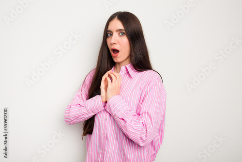 Young caucasian woman isolated on white background scared and afraid.