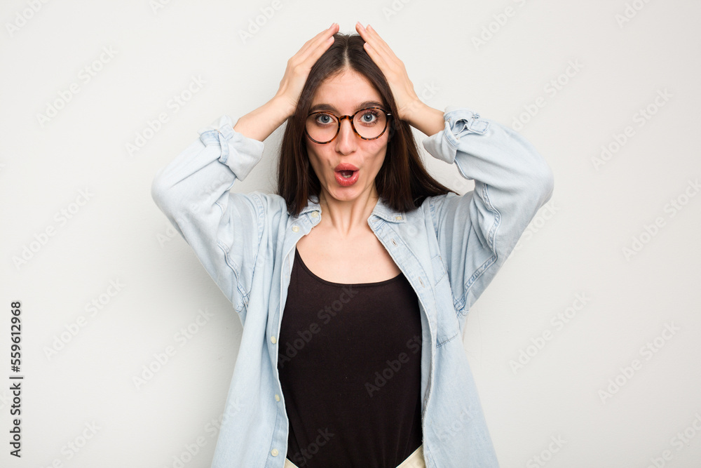 Young caucasian woman isolated on white background surprised and shocked. Young caucasian woman isolated on white background surprised and shocked.