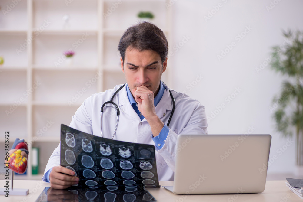Young male doctor radiologist working at the hospital Young male doctor radiologist working at the hospital