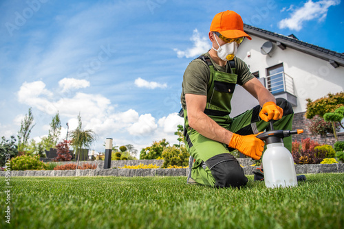 Professional Gardener with One Handed Pump Pesticide Sprayer photo