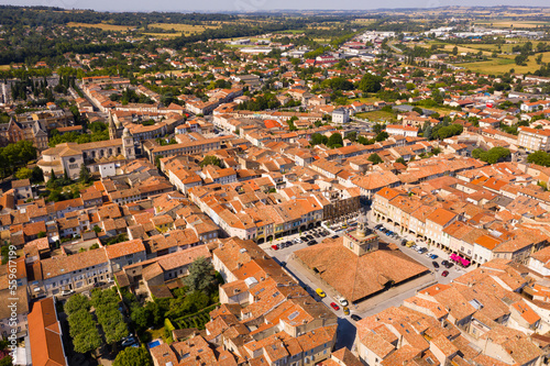 Tableau sur toile View from drone of houses of Revel town and historic covered market hall at sunn