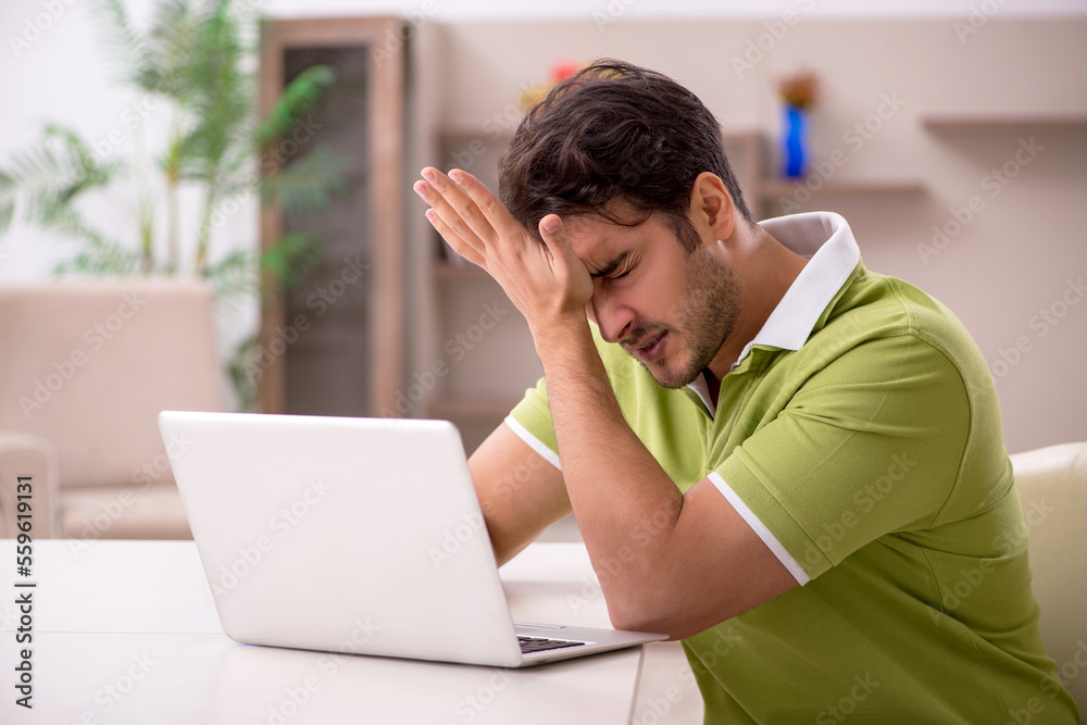 Young man working from home during pandemic Young man working from home during pandemic