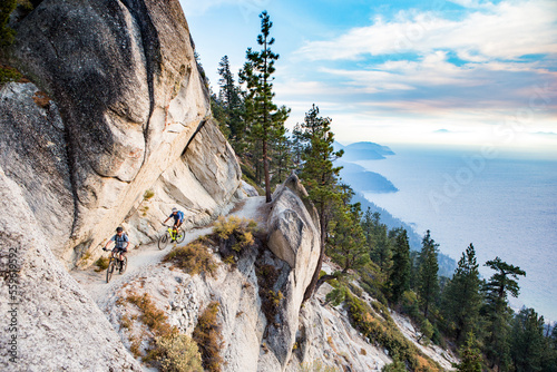 Mountain bikers on mountainside, Flume Trail, Lake Tahoe, Nevada, USA