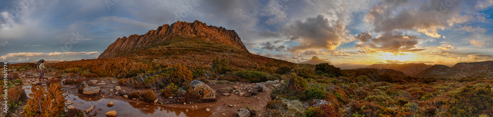 Backpacker Passing Through Cradle Mountain In Saint Clair National Park Backpacker Passing Through Cradle Mountain In Saint Clair National Park