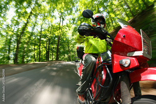 Motion-blur bike-mounted camera angle of a motorcycle riding on a forested road in the New River Gorge near Fayetteville, WV