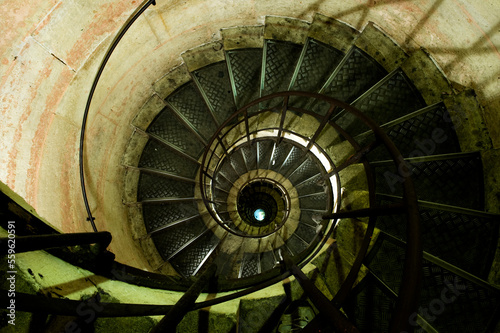 A fish eye view of a spiraling stair case in Paris France. photo