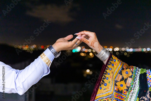 Afghani couple's holding hands close up photo