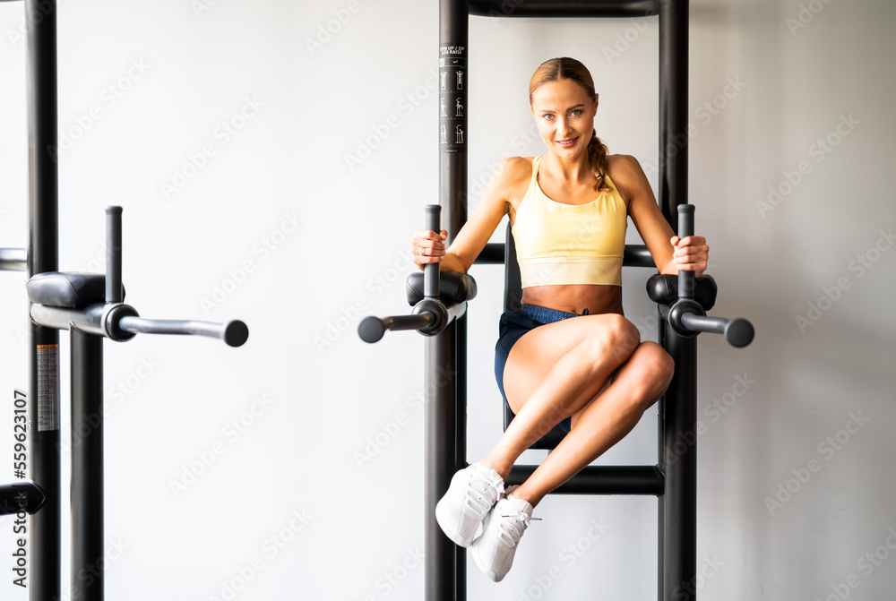 Woman doing free body exercises in the gym Woman doing free body exercises in the gym