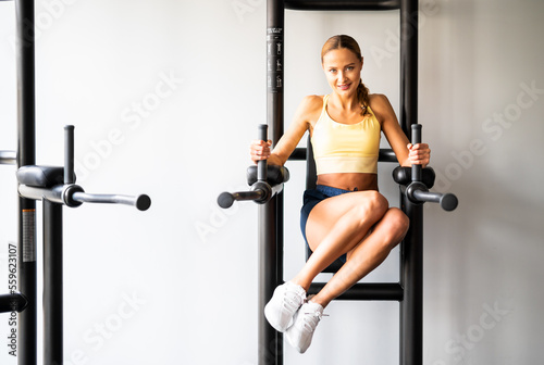 Woman doing free body exercises in the gym