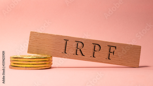 IRPF was written on the wooden surface. Wooden Concept photo