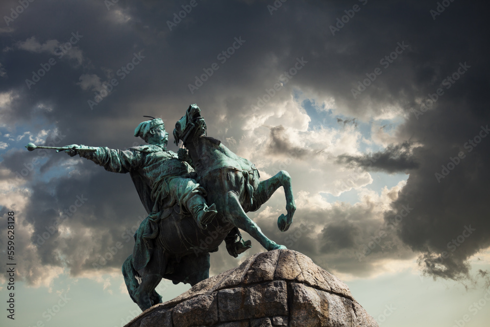 Monument of Bohdan Khmelnytsky, the Hetman of Ukrainian Zaporozhian Cossacks, on Sofia square in Kyiv, Ukraine. Dramatic sky on the background.