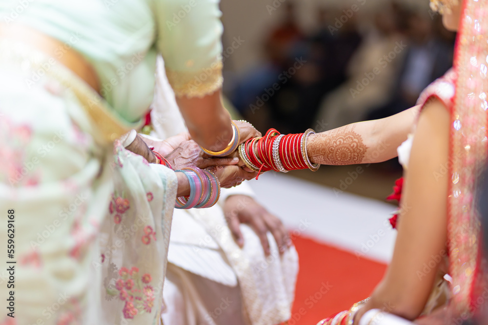 Indian Hindu wedding rituals bride and groom's hands close up