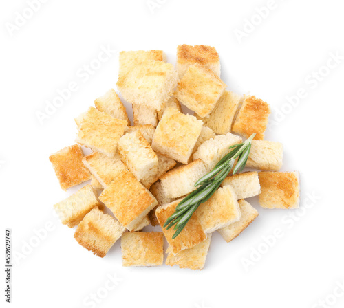 Delicious crispy croutons with rosemary on white background, top view