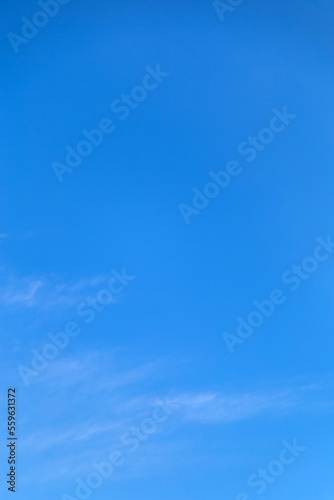 Vetical image a white clouds in blue sky for background