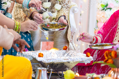 Indian Hindu wedding sacred fire rituals hands close up