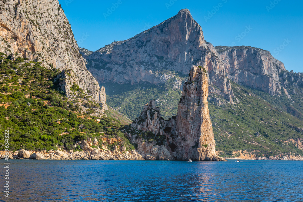 Sardinian seashore in the Baunei municipality with Pedra Longa cliff, Italy