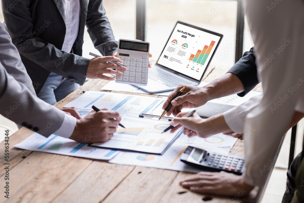 Group of confident business people point to graphs and charts to analyze market data, balance sheet, account, net profit to plan new sales strategies to increase production capacity.	 - obrazy, fototapety, plakaty 
