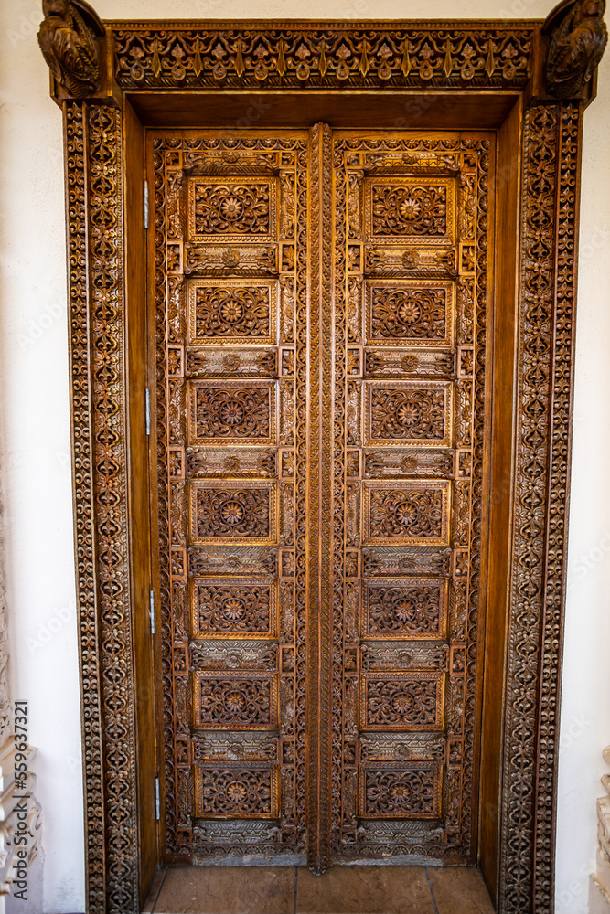 Indian Hindu temple carved wooden door design, texture and details