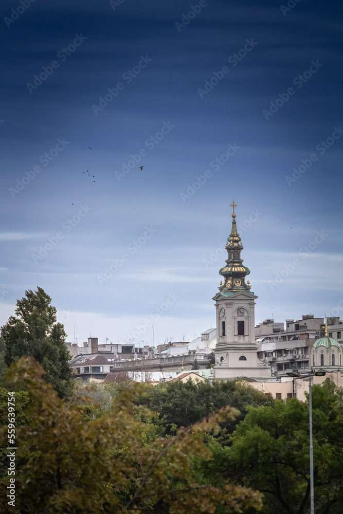 Saint Michael Cathedral, also known as Saborna Crkva, with its iconic clocktower seen from a street of Stari Grad district. It is one of the main landmarks of Belgrade, Serbia....