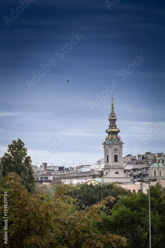 Saint Michael Cathedral, also known as Saborna Crkva, with its iconic clocktower seen from a street of Stari Grad district. It is one of the main landmarks of Belgrade, Serbia....