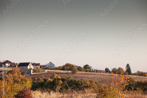 typical European countryside landscape, with farms, agricultural fields, trees, in a valley near Ralja, in Sopot, Central Serbia, in Kosmaj mountain, in sunny summer, in a European rural environment photo