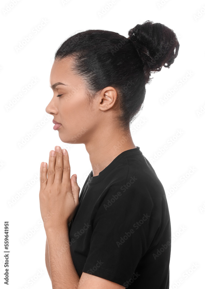 African American woman with clasped hands praying to God on white background African American woman with clasped hands praying to God on white background