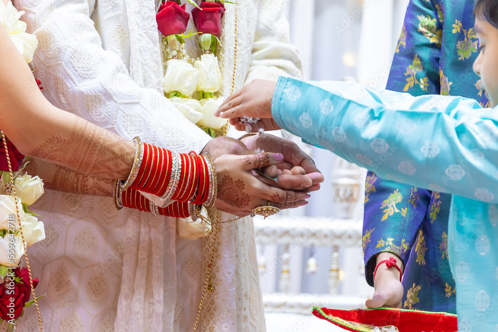 Indian Hindu wedding ceremony rituals bride and groom's hands close up
