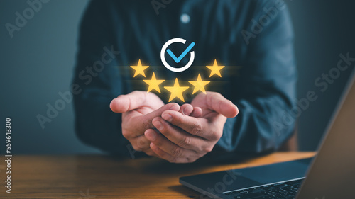 Businessman Hand shows the sign of the top service the best Quality assurance, Guarantee, Standards, ISO certification and standardization concept. guarantee product and ISO service concept.