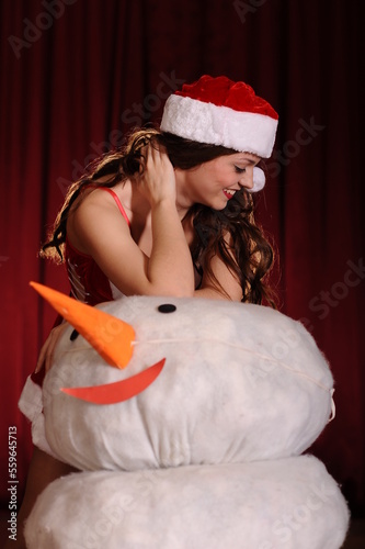 Studio shot of beautiful young woman in snowgirl dress photo