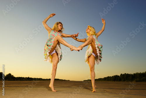 young women dancing in the evening time