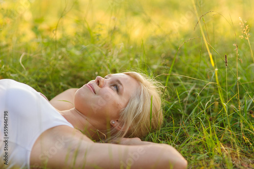 calm smiling woman resting in the park