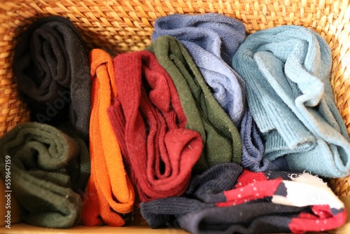 Multiple socks folded and stored in a box.