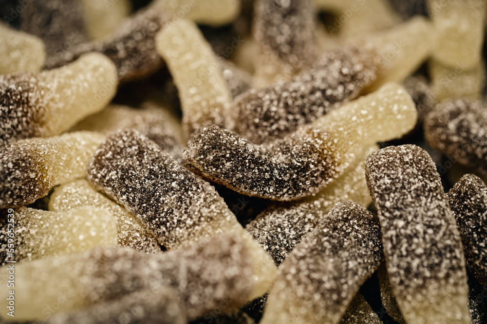 Background of chewy gelatin sweets covered with sugar, close-up. Background of chewy gelatin sweets covered with sugar, close-up.