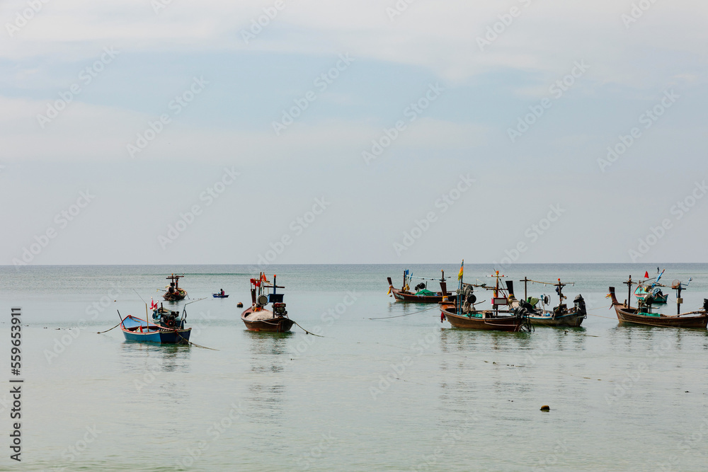Traditional Thai longtail boats moored off the coastline, province, Thailand
