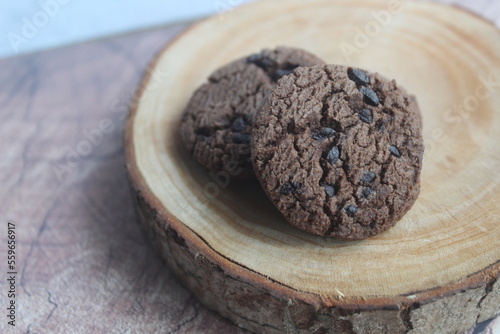 a pile of chocolate chip cookies sprinkled with chocochips photo