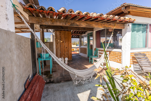 A wonderful open kitchen combined with a balcony and panoramic mountain views and a cozy hammock for relaxation.