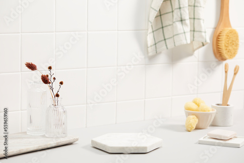 Fototapeta Naklejka Na Ścianę i Meble -  bathroom with white tile wall and bath objects. space for text, copy space
