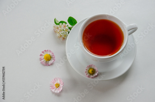 cup of tea on a light background with flowers