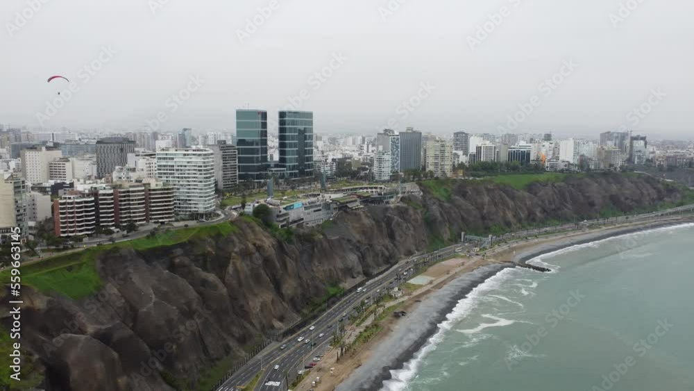 A view of the Miraflores waterfront, with a paraglider flying in the sky. Lima, Peru A view of the Miraflores waterfront, with a paraglider flying in the sky. Lima, Peru