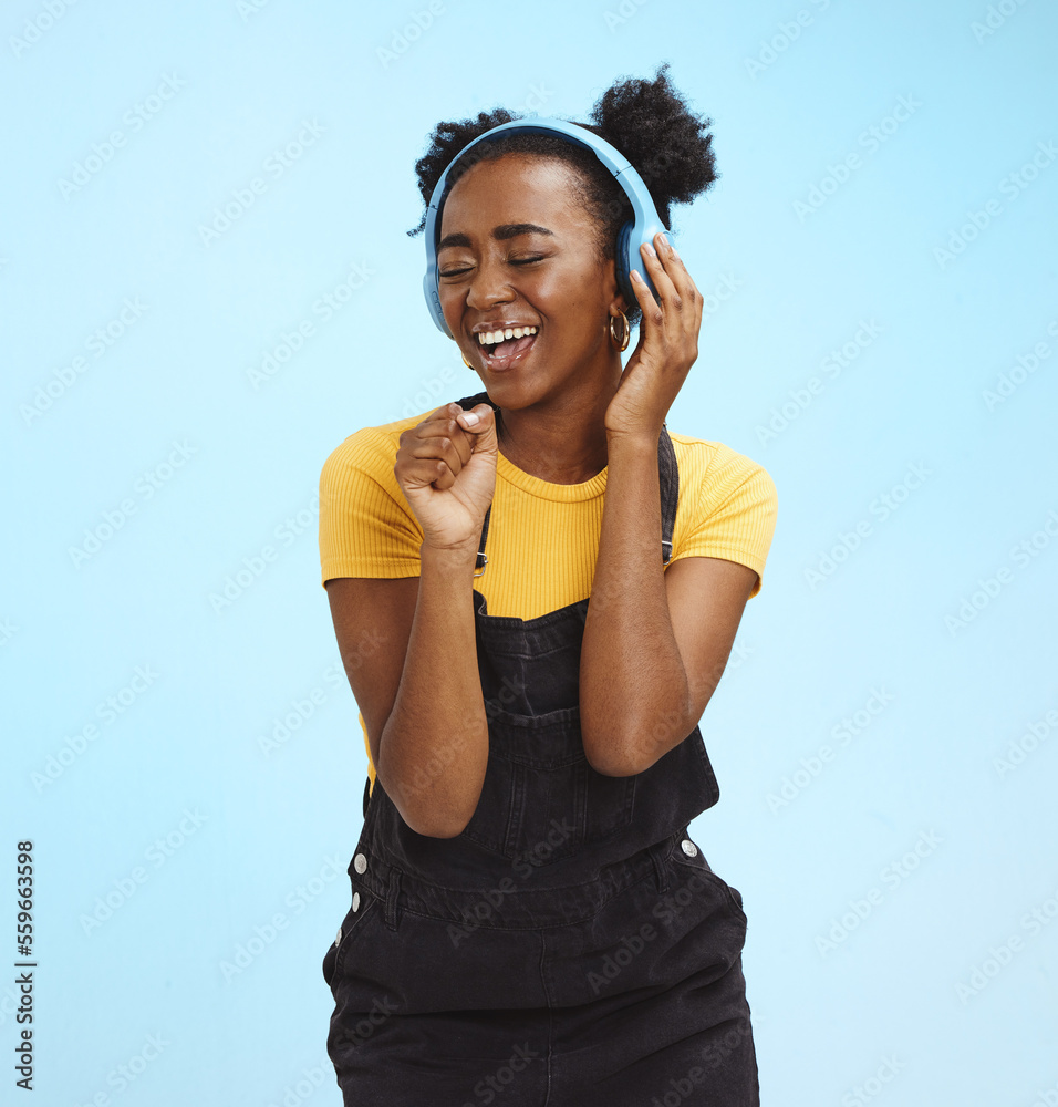 Music, dance and freedom with black woman and headphones, singing for  relax, celebration and streaming. Audio, smile and technology with girl  listening to online radio for playlist, energy and happy Stock Photo