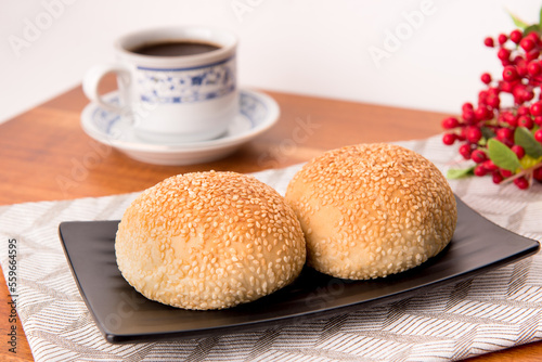 Kompyang bread or Kompia or Guang Bing, a typical Chinese bread that is popular in Indonesia, both filled with meat and empty. Its signature with a sprinkling of sesame on top