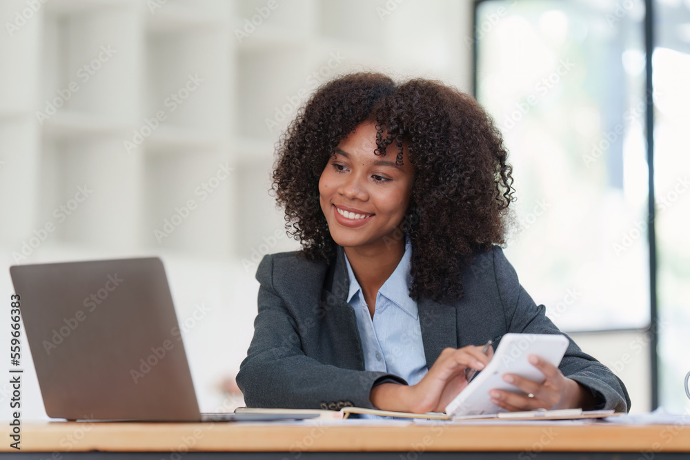 Financial advisor, corporate accountant and african woman in office. analyzing benefits, enjoying financial success, job high result