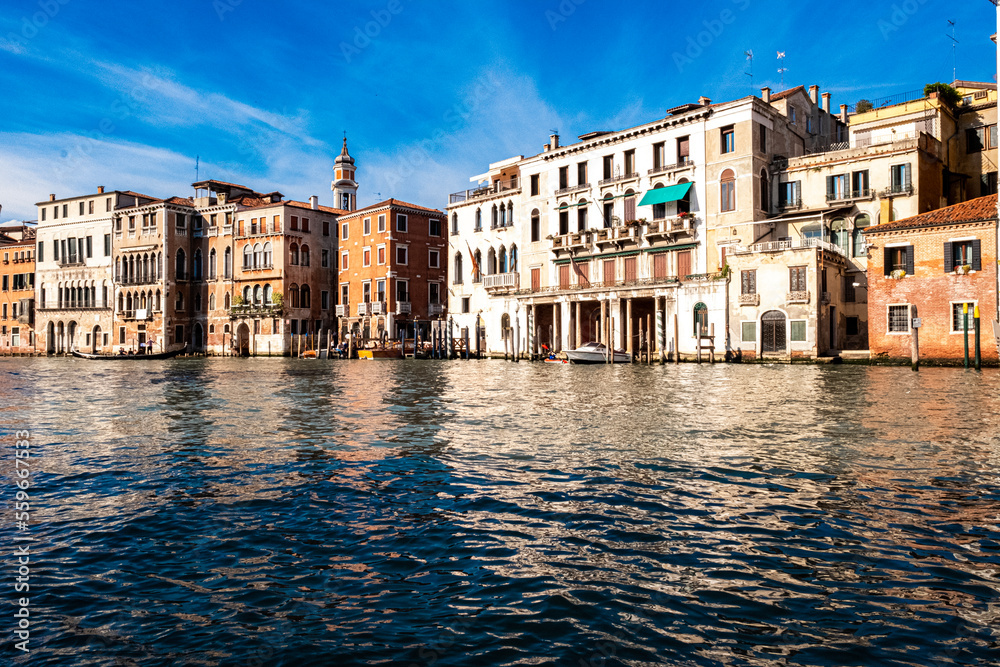 The magical journey to magnificent Venice. Walk on Vaporetto along the Grand Canal on a beautiful sunny day. 