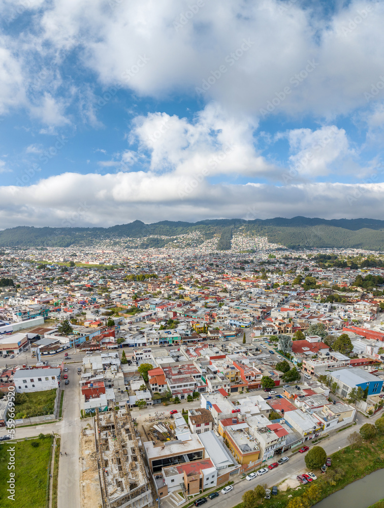 Aerial view of colorful mountain village of San Cristobal in Mexico. Panorama.
