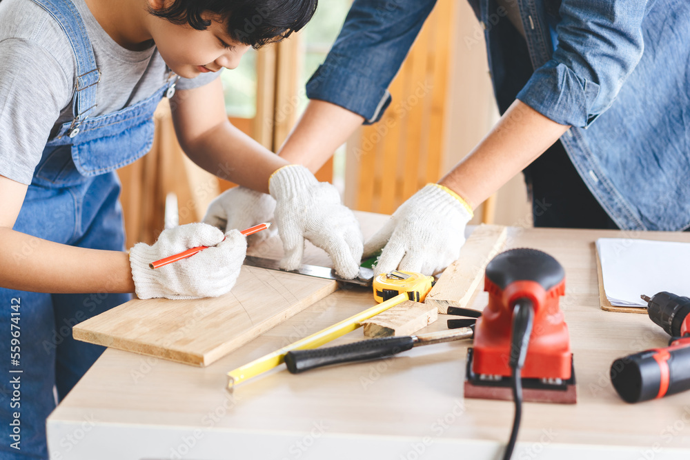 Southeast asian family father and son diy or repair for crafts skill at home workshop Southeast asian family father and son diy or repair for crafts skill at home workshop