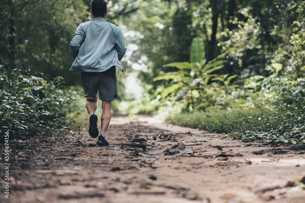 healthy lifestyle young fitness man running the forest. Outdoor workout, Healthy lifestyle concept. healthy lifestyle young fitness man running the forest. Outdoor workout, Healthy lifestyle concept.
