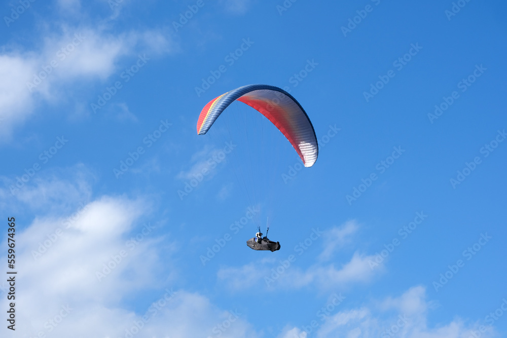 Paramotor sport. man driving a paramotor See the beautiful scenery cloudy sky background extreme sports concept Paramotor sport. man driving a paramotor See the beautiful scenery cloudy sky background extreme sports concept