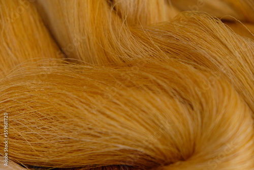 Raw, unprocessed silk yarn from yellow cocoons of the silk worm.