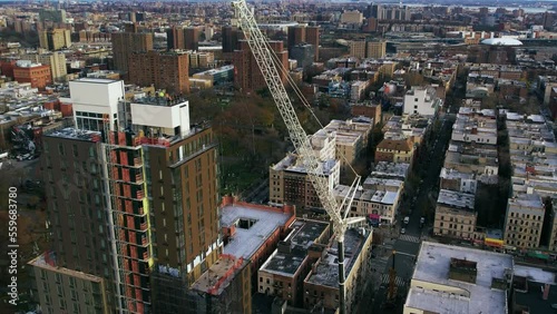 Tower crane lifting construction material rods at Flushing NewYork photo